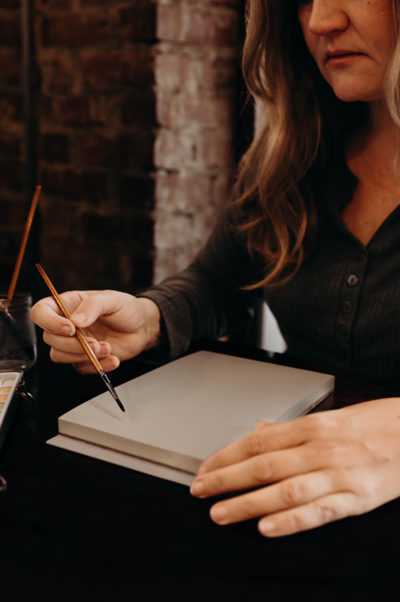 Brandy writing in a journal
